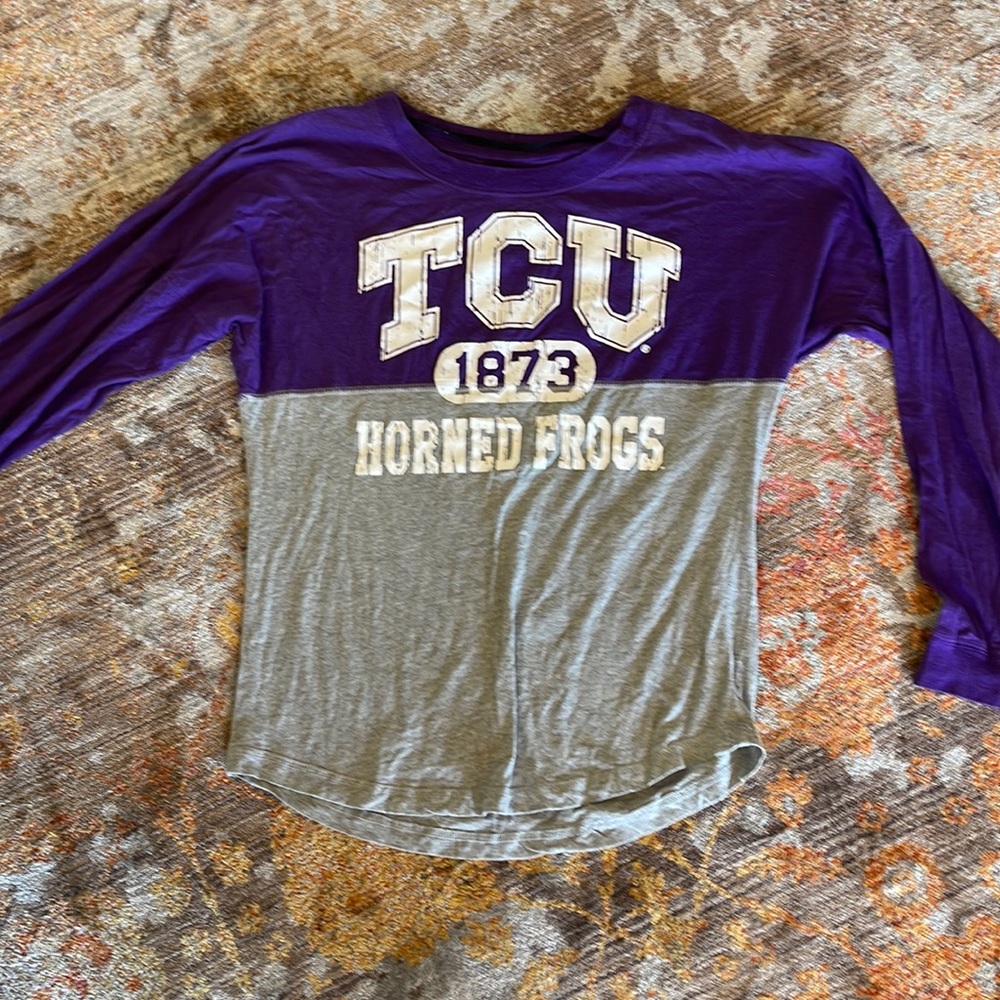 TCU college shirt.